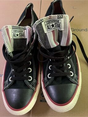 Converse Low-Top Black Canvas Sneakers with Red and White Striped Tongue